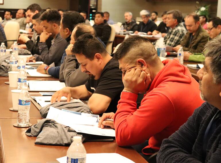 Men attending a seminar.