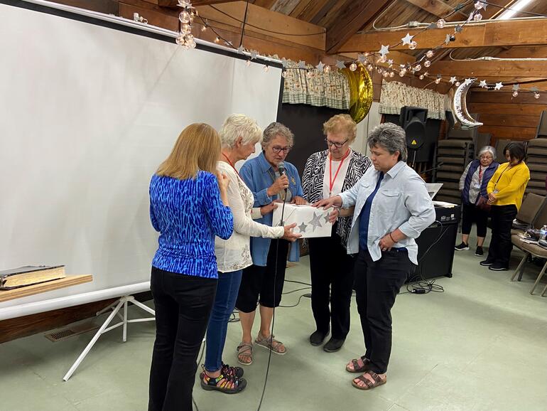 The ladies prayed for the requests in the box.