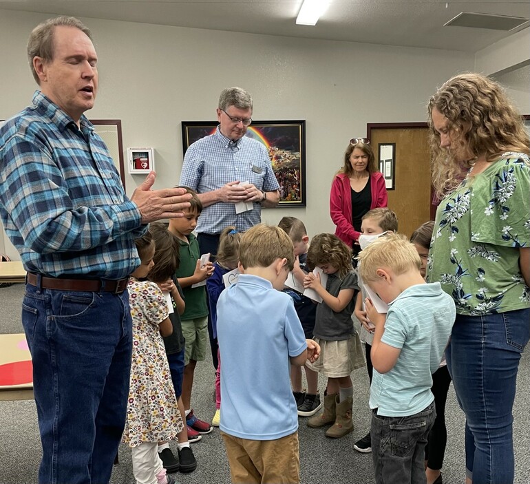 Pastor Thomas Bentley (left) with students