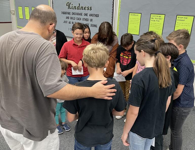 Pastor Edward Nelson with students