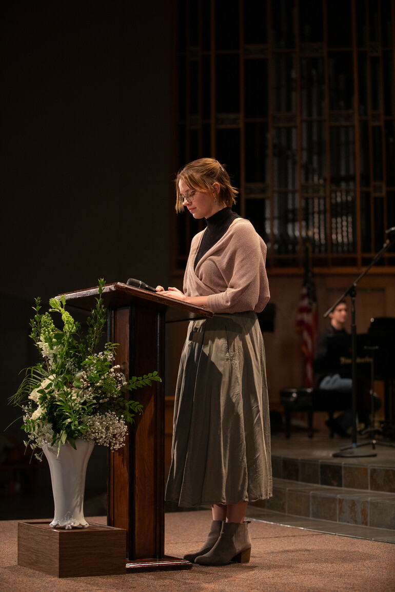 Student reads scripture in church