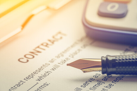 Legal contract with a pen.