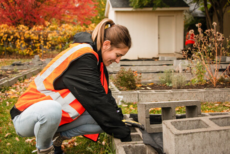 Student constructs a garden bed.