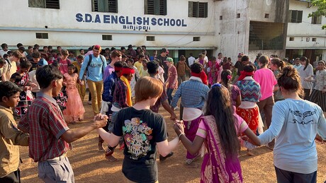 people in front of school in India