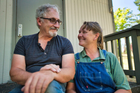 Man and woman sitting, looking at each other