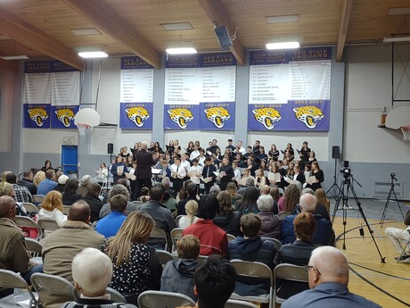 Family and guests listen to the choirs