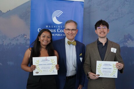 Anderson and Perez stand with awards on either side of McVay.