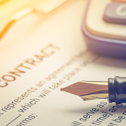 Legal contract with a pen.