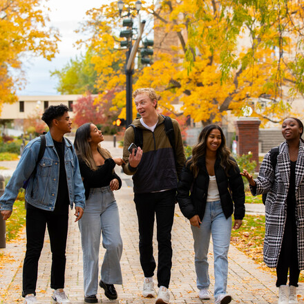 Group of students walk outside