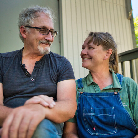 Man and woman sitting, looking at each other
