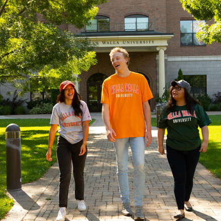 Students walk on campus in WWU gear