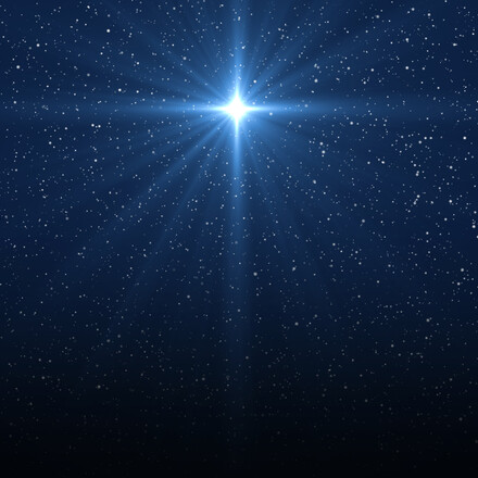 Christmas star of the Nativity of Bethlehem, Nativity of Jesus Christ. Background of the beautiful dark blue starry sky and bright star.