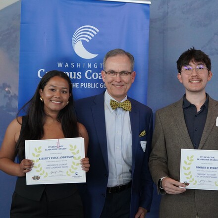 Anderson and Perez stand with awards on either side of McVay.