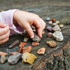 Child is playing with stones