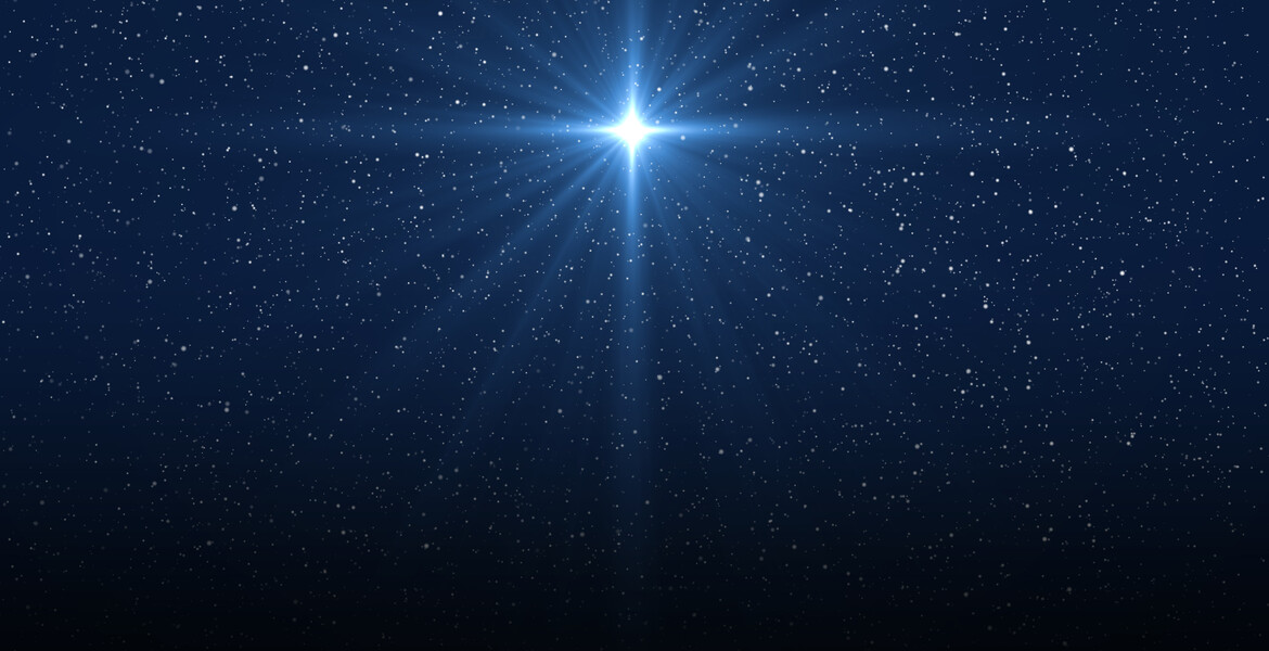 Christmas star of the Nativity of Bethlehem, Nativity of Jesus Christ. Background of the beautiful dark blue starry sky and bright star.